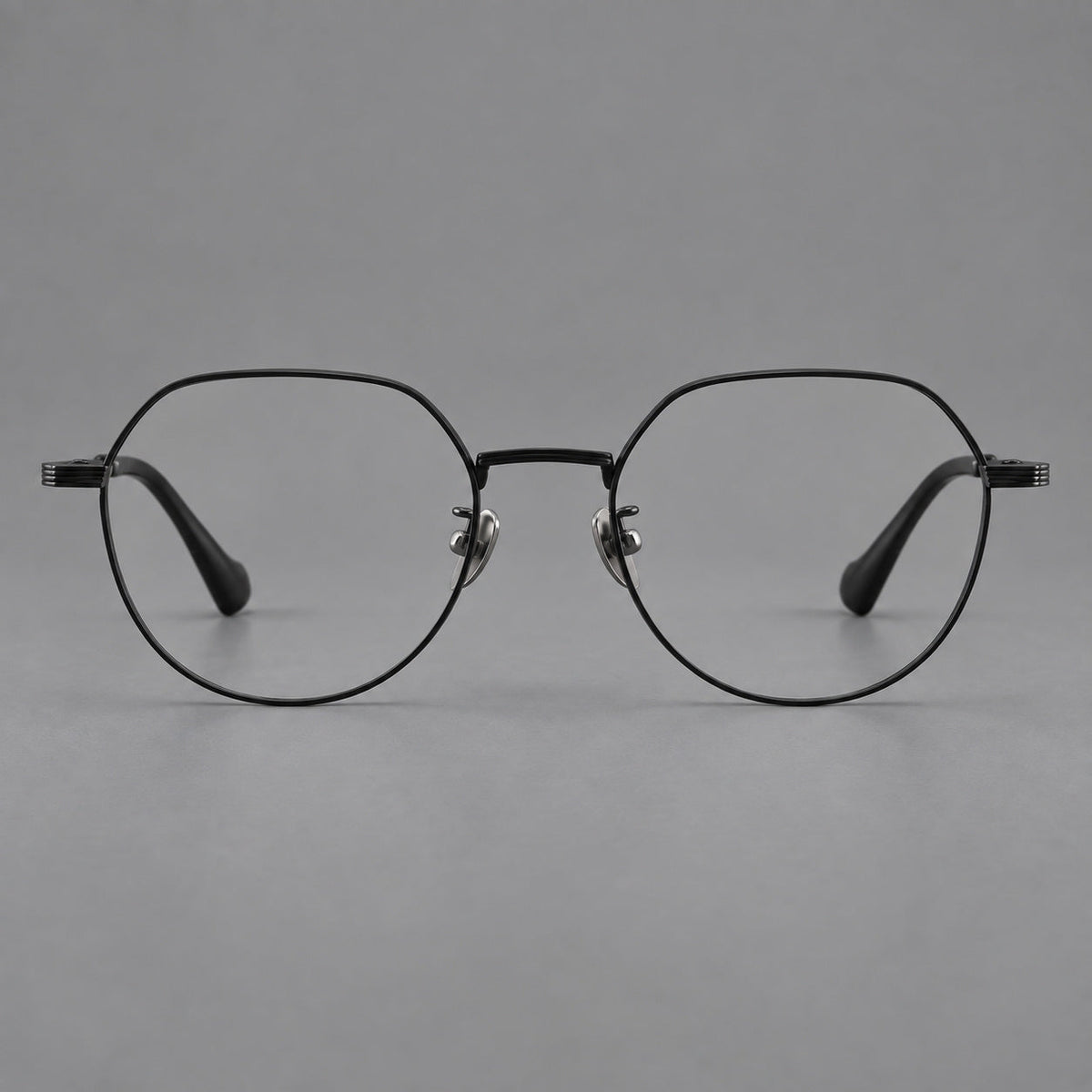 Geometric titanium glasses with soft polygonal rims and fine shoulder detailing in Black, front view