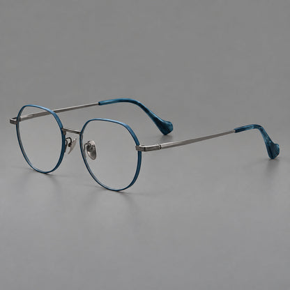 Geometric titanium glasses with soft polygonal rims and fine shoulder detailing in Blue and Gunmetal, three quarter view front view