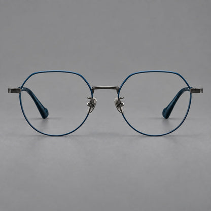 Geometric titanium glasses with soft polygonal rims and fine shoulder detailing in Blue and Gunmetal, front view frame detail