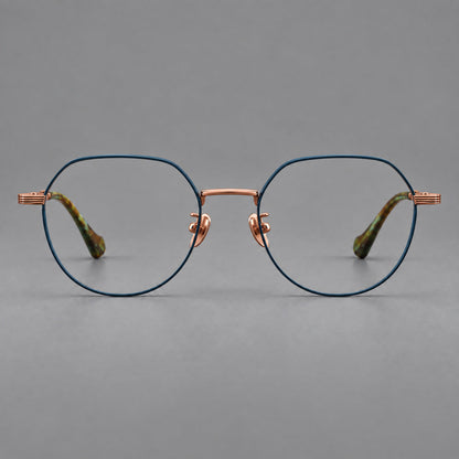 Geometric titanium glasses with soft polygonal rims and fine shoulder detailing in Blue and Rose Gold, front view temple detail