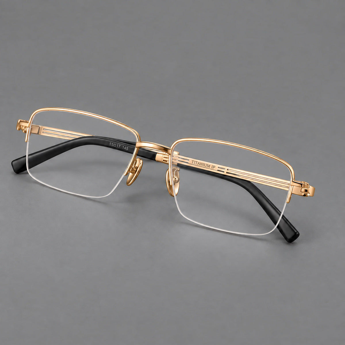 Classic half frame titanium glasses with rectangular lenses and lined temples in Gold, three quarter view