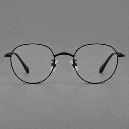 Compact round titanium glasses with an arched bridge and textured temple accents in Black, front view side view