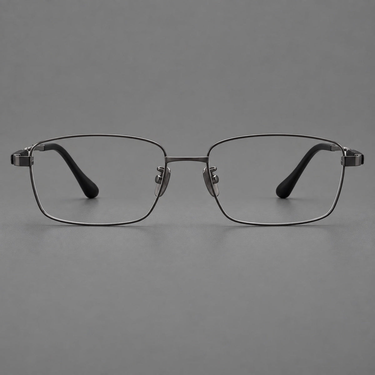 Slim rectangular titanium glasses with broad temples and contrasting dark inserts in Gunmetal, front view