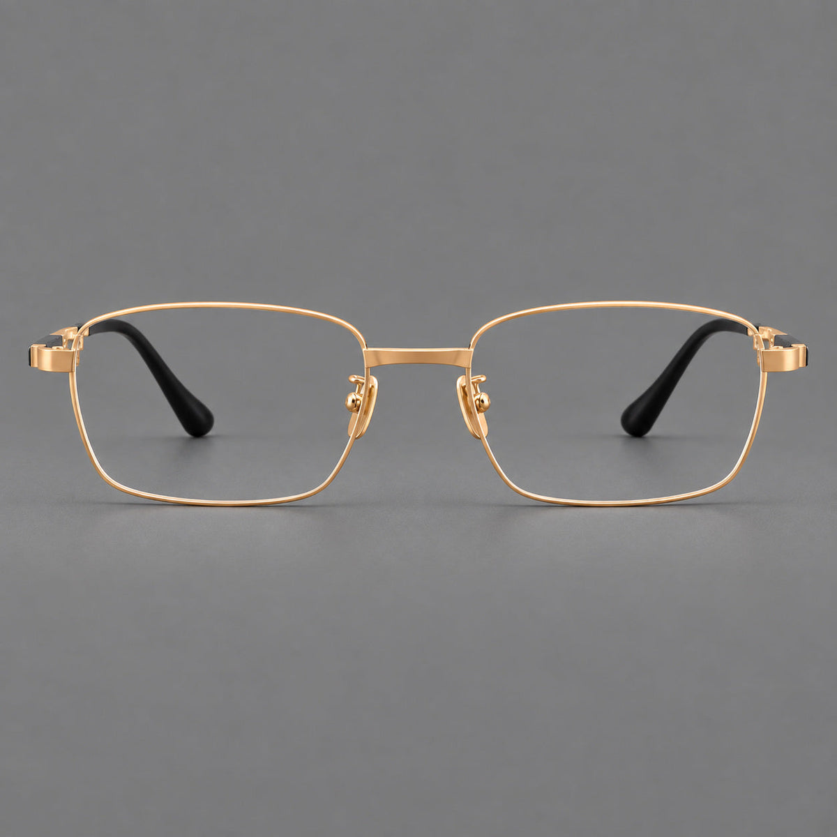 Slim rectangular titanium glasses with broad temples and contrasting dark inserts in Gold, front view