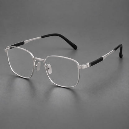 Slim rectangular titanium glasses with broad temples and contrasting dark inserts in Silver, three quarter view additional product view