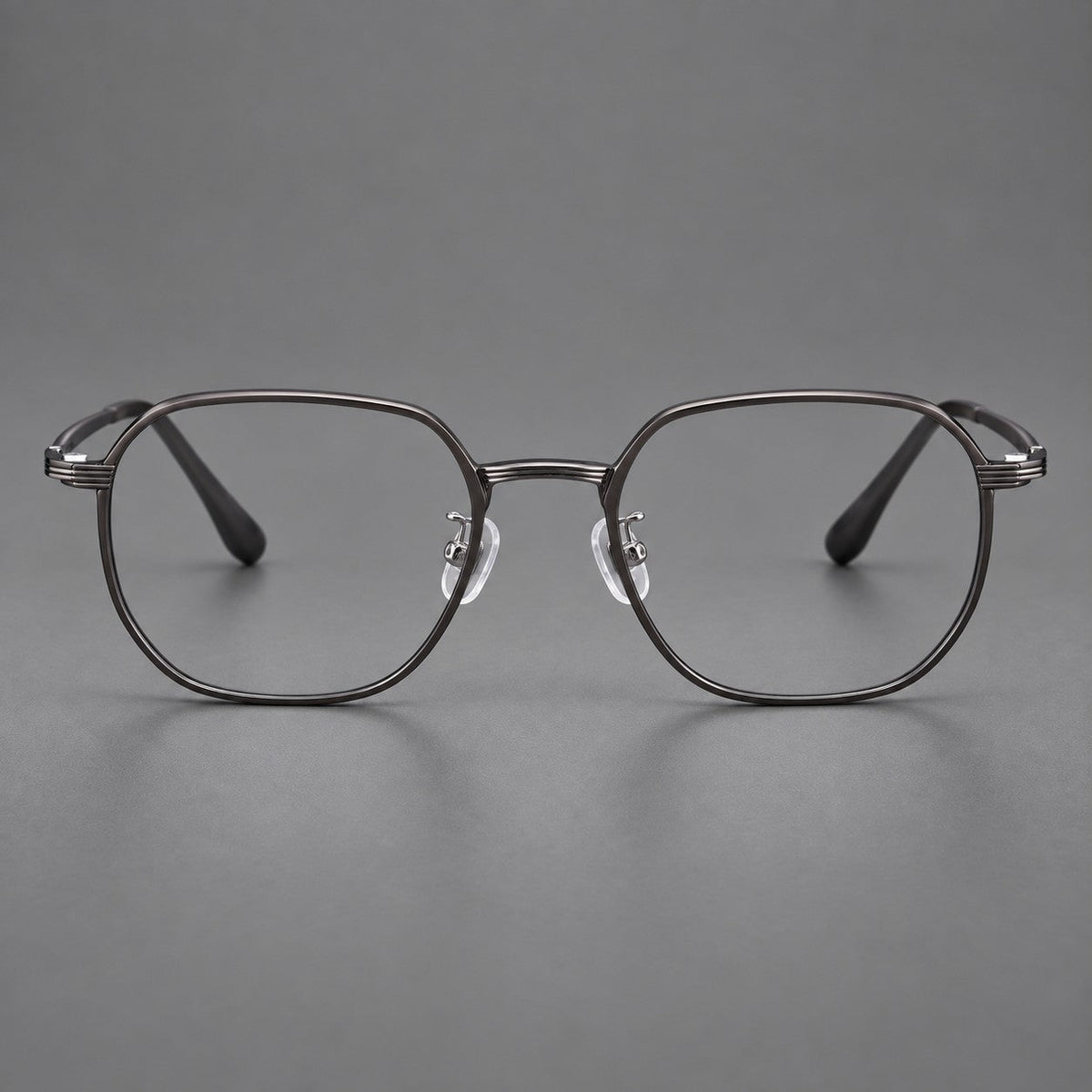 Geometric titanium glasses with flattened corners and a finely ridged bridge in Dark Gray, front view