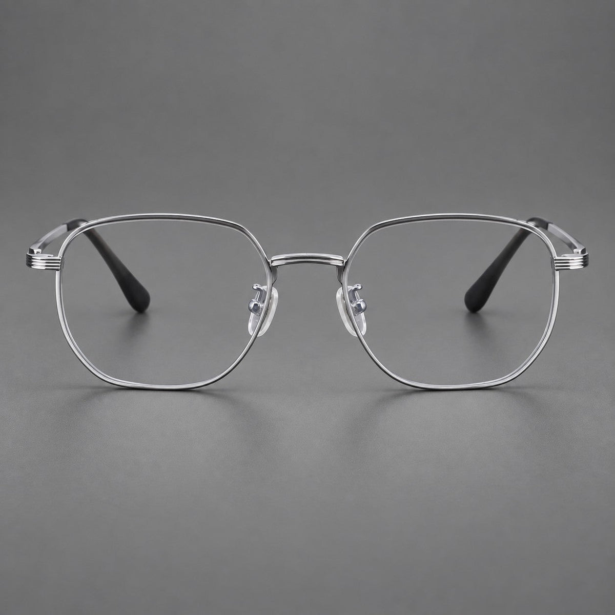 Geometric titanium glasses with flattened corners and a finely ridged bridge in Silver, front view
