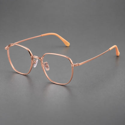 Geometric titanium glasses with flattened corners and a finely ridged bridge in Rose Gold, three quarter view additional product view