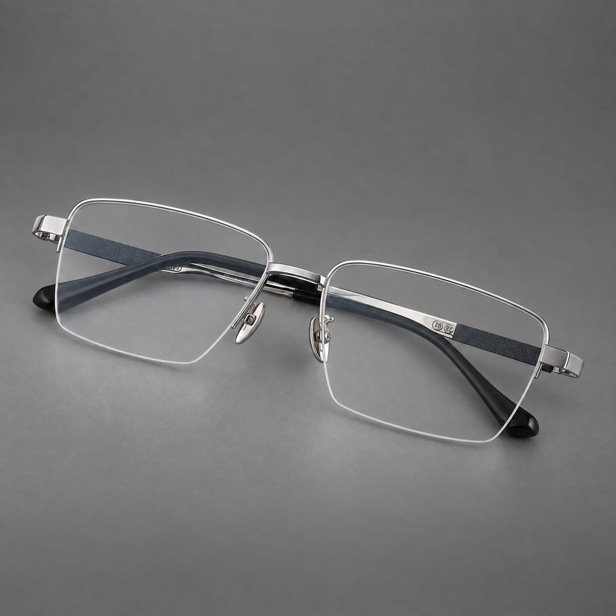 Wide half frame titanium glasses with rectangular lenses and textured temples in Silver, three quarter view