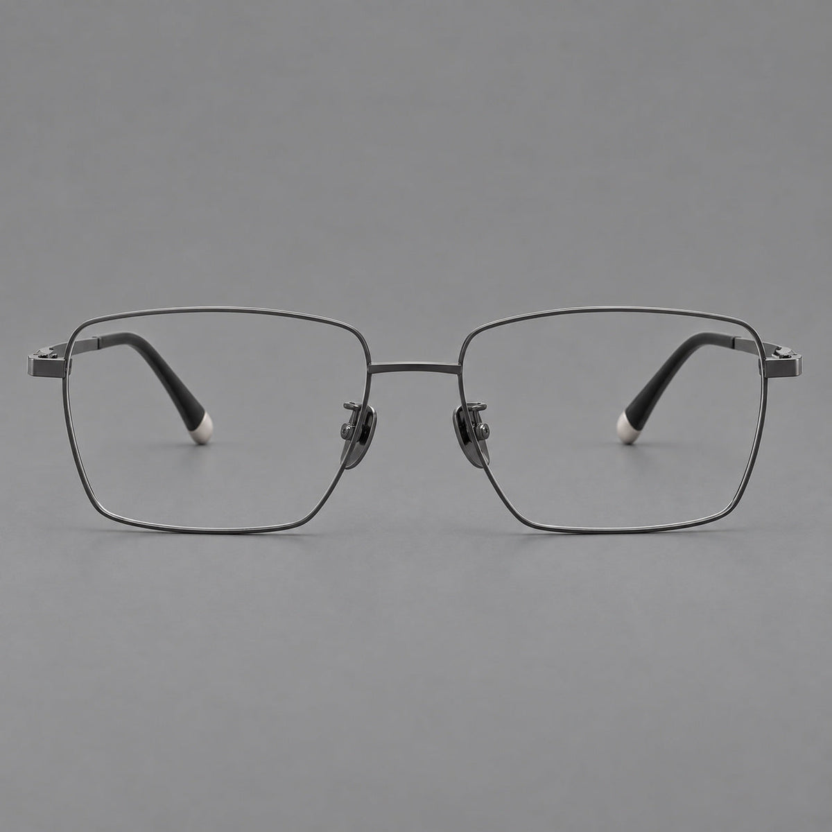 Clean rectangular titanium glasses with inset temple details and pale end accents in Gunmetal, front view
