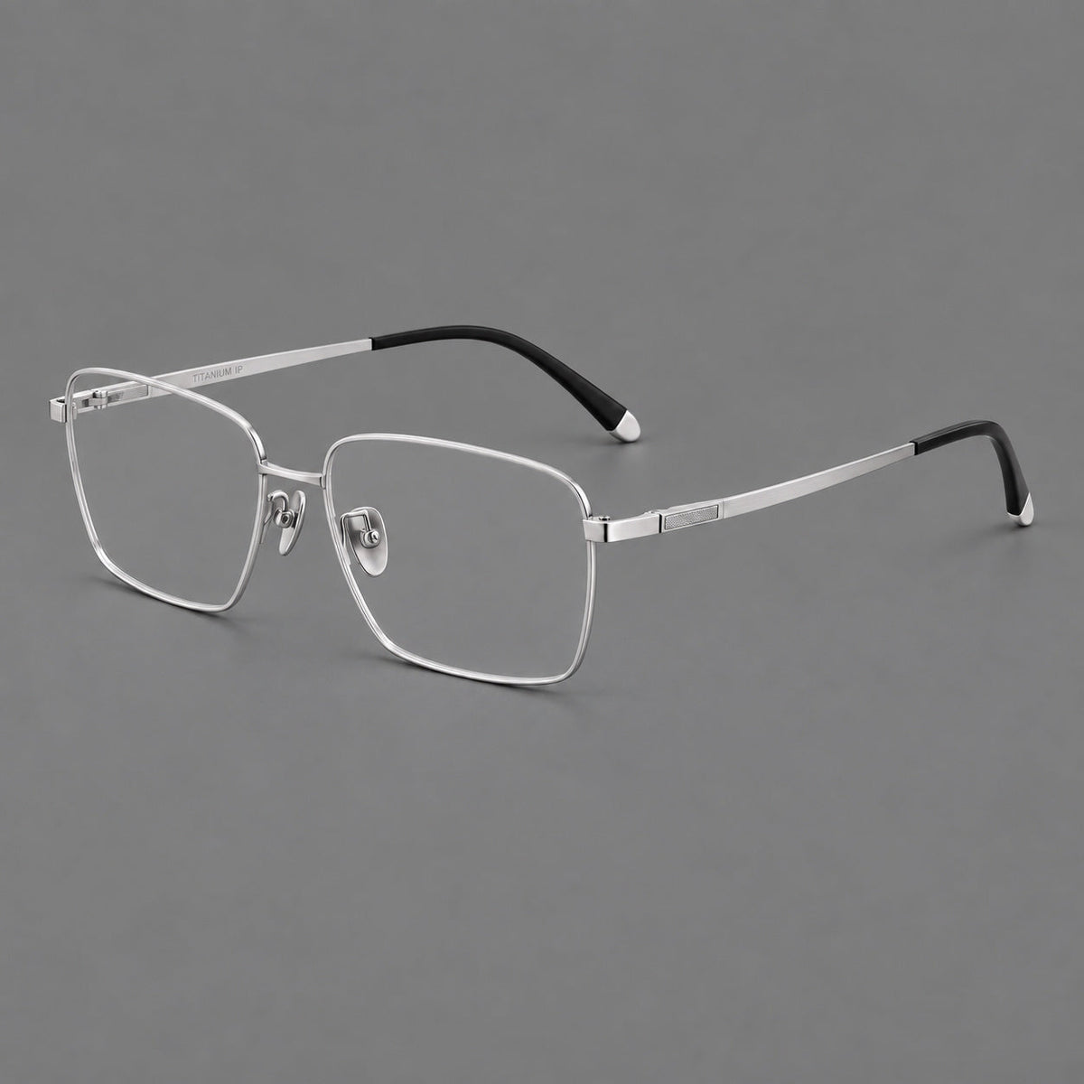 Clean rectangular titanium glasses with inset temple details and pale end accents in Silver, three quarter view