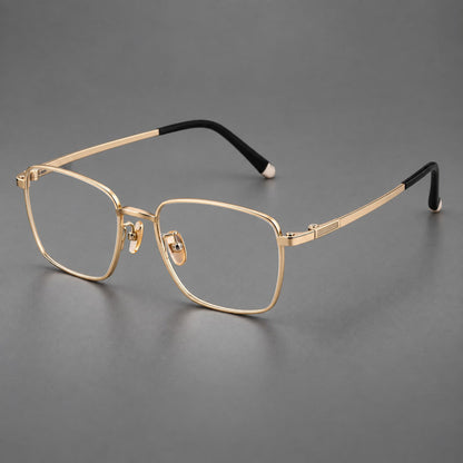 Clean rectangular titanium glasses with inset temple details and pale end accents in Gold, three quarter view additional product view