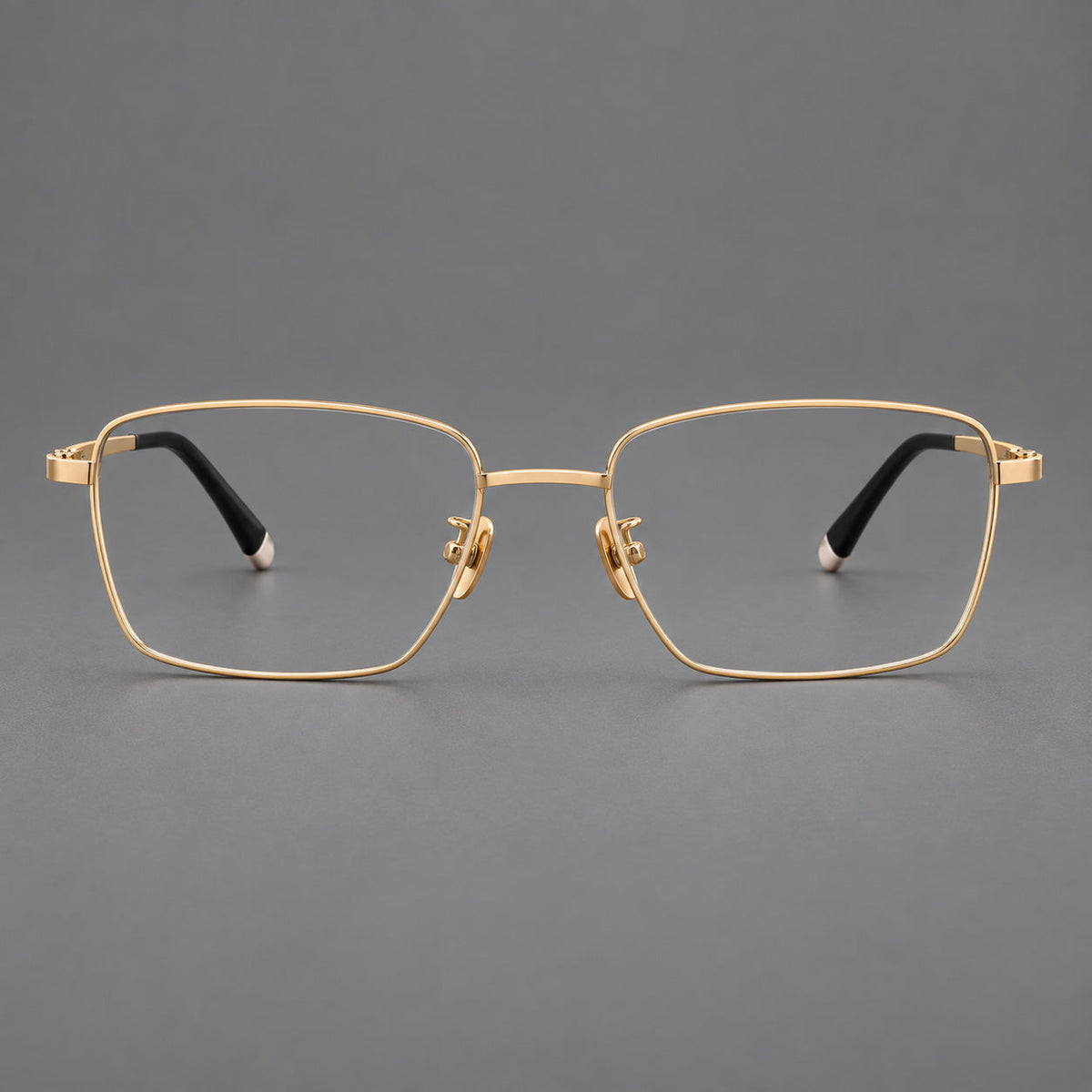 Clean rectangular titanium glasses with inset temple details and pale end accents in Gold, front view