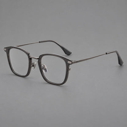 Bold square titanium glasses with a separate bridge and long metal corner accents in Gunmetal, three quarter view