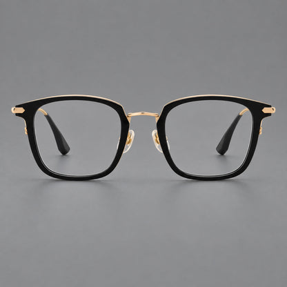 Bold square titanium glasses with a separate bridge and long metal corner accents in Black and Gold, front view frame detail