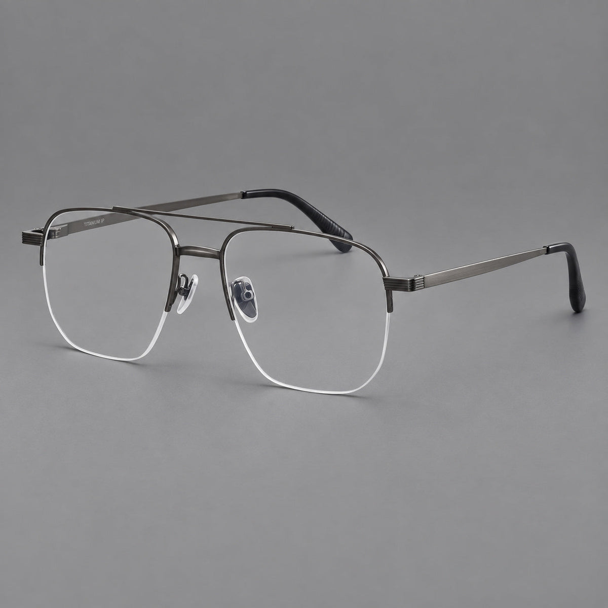 Angular aviator titanium glasses with a double bridge and an open lower rim in Gunmetal, three quarter view