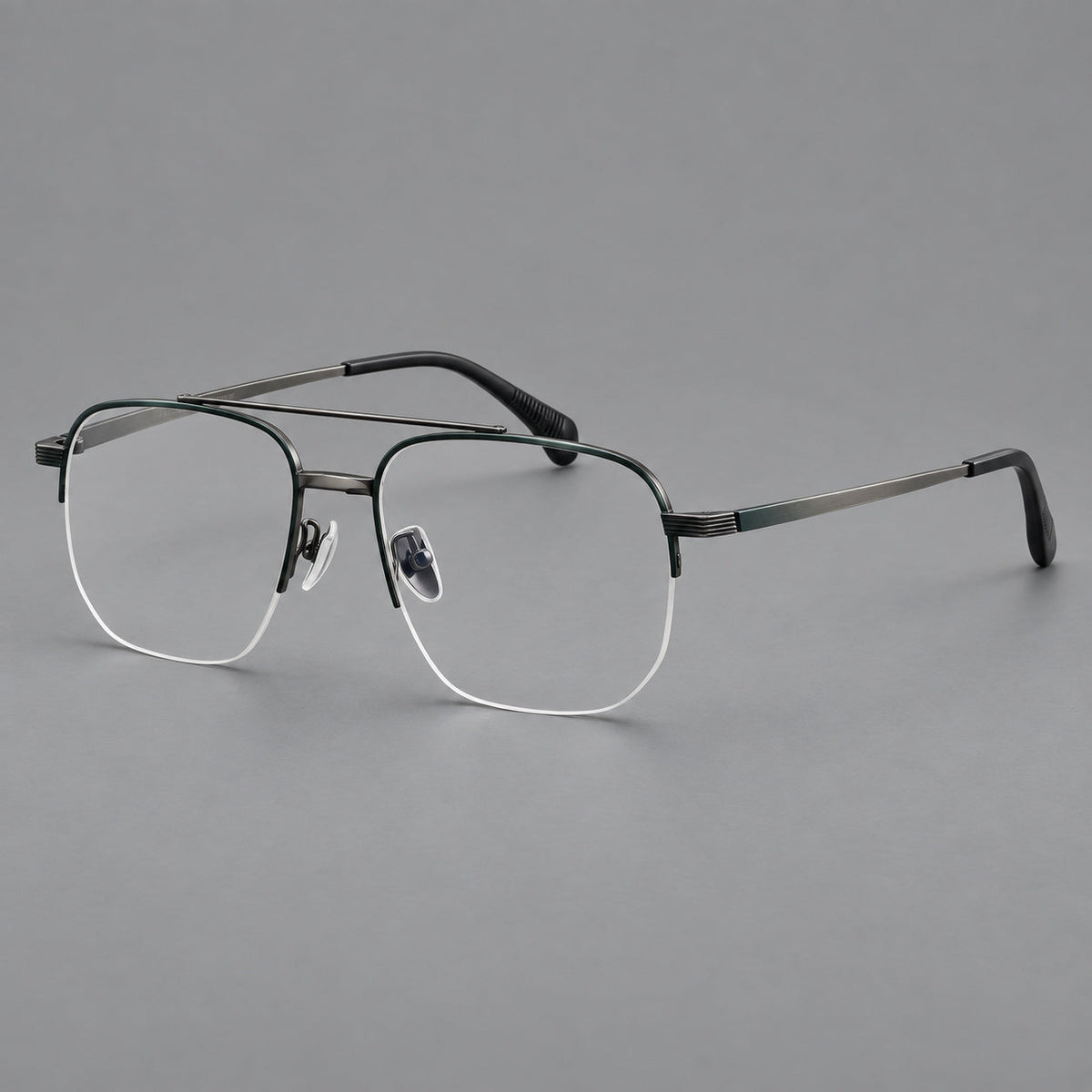 Angular aviator titanium glasses with a double bridge and an open lower rim in Dark Green and Gunmetal, three quarter view