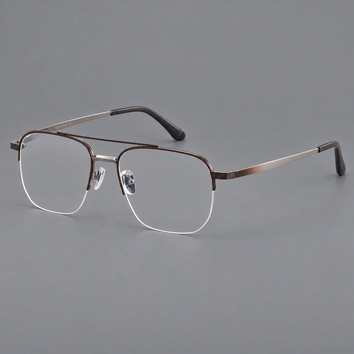 Angular aviator titanium glasses with a double bridge and an open lower rim in Brown and Silver, three quarter view