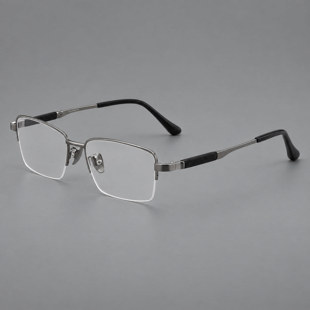 Modern half frame titanium glasses with a narrow bridge and dark temple sections in Gray, three quarter view