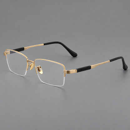 Modern half frame titanium glasses with a narrow bridge and dark temple sections in Gold, three quarter view lens detail