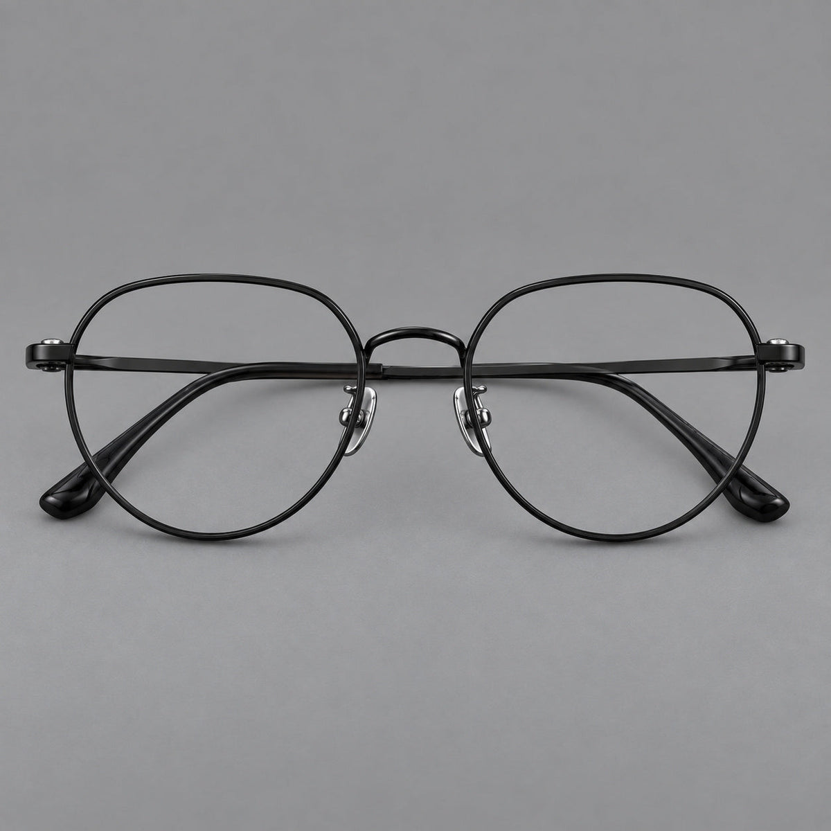 Classic panto titanium glasses with a curved bridge and slim straight temples in Black, front view