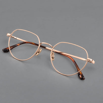 Classic panto titanium glasses with a curved bridge and slim straight temples in Rose Gold, three quarter view additional product view