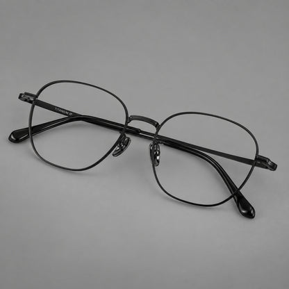 Retro panto titanium glasses with stepped corners and finely engraved temples in Black, three quarter view