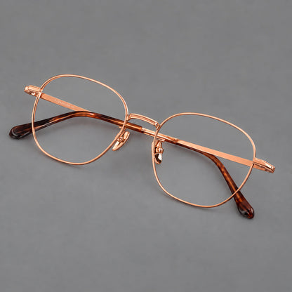 Retro panto titanium glasses with stepped corners and finely engraved temples in Rose Gold, three quarter view additional product view