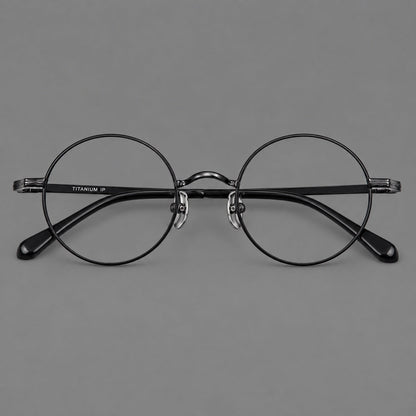 Compact circular titanium glasses with a curved bridge and wavy engraved temples in Black, front view side view
