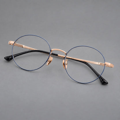 Classic circular titanium glasses with a raised bridge and lined temple accents in Blue and Gold, three quarter view front view