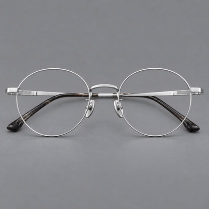 Classic circular titanium glasses with a raised bridge and lined temple accents in Silver, front view temple detail