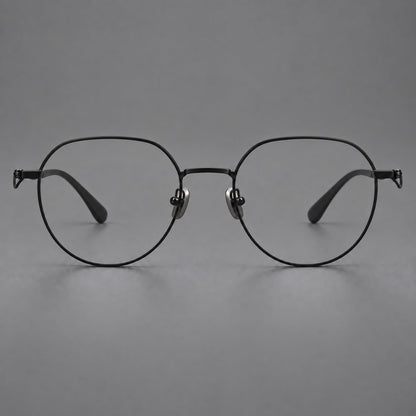 Rounded titanium glasses with a short bridge and distinctive wavy metal temples in Matte Black, front view side view