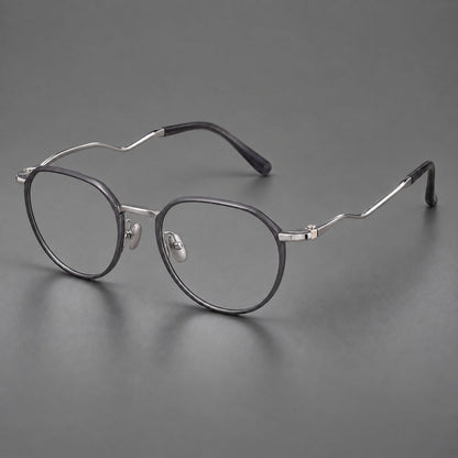 Rounded titanium glasses with a short bridge and distinctive wavy metal temples in Matte Gray and Silver, three quarter view front view