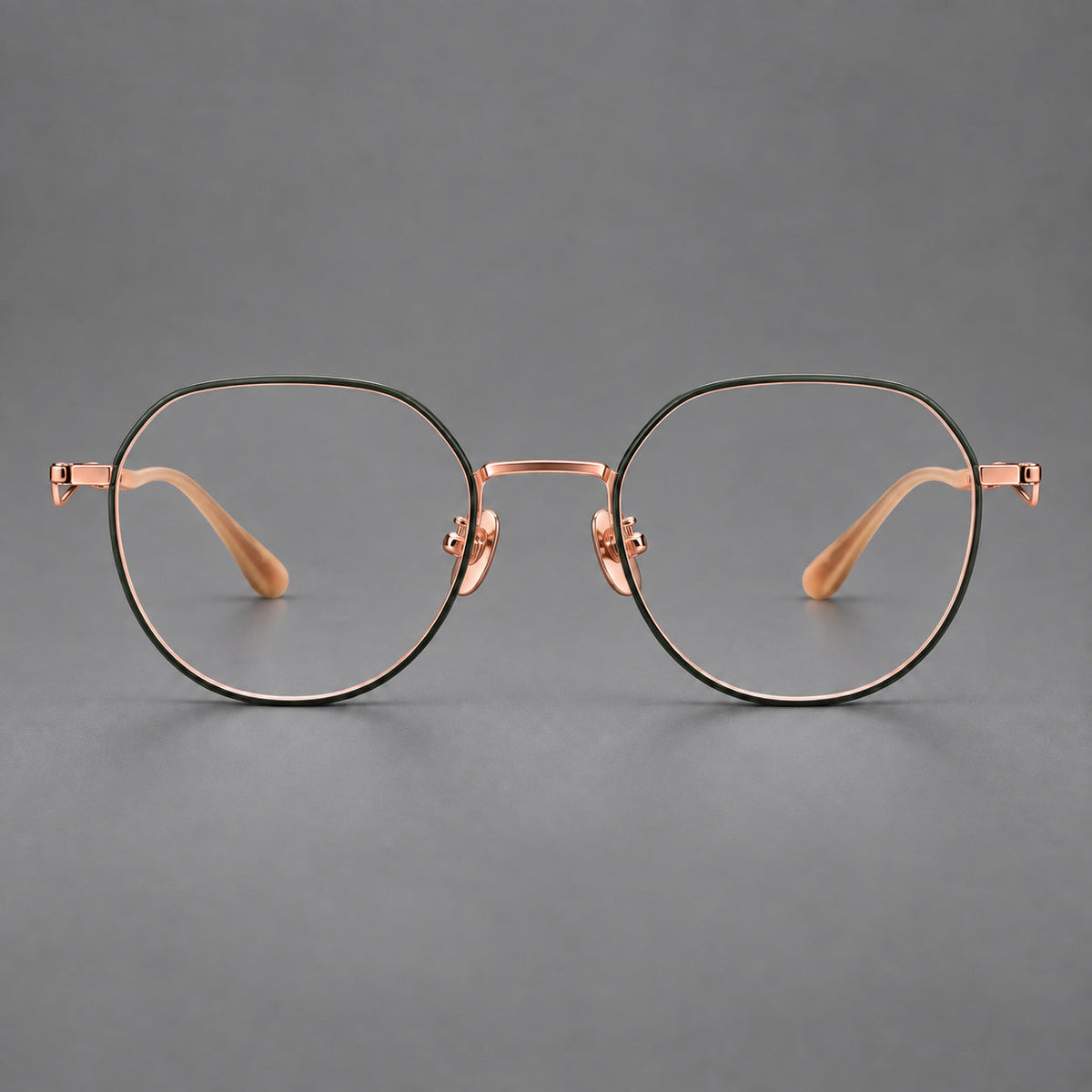 Rounded titanium glasses with a short bridge and distinctive wavy metal temples in Dark Green and Rose Gold, front view