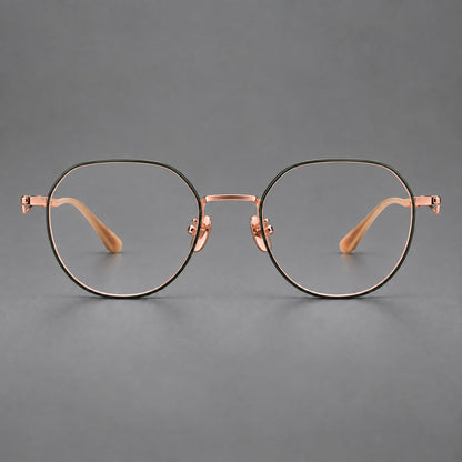 Rounded titanium glasses with a short bridge and distinctive wavy metal temples in Dark Green and Rose Gold, front view temple detail