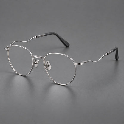 Rounded titanium glasses with a short bridge and distinctive wavy metal temples in Silver, three quarter view additional product view
