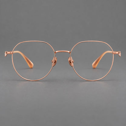 Rounded titanium glasses with a short bridge and distinctive wavy metal temples in Rose Gold, front view additional product view