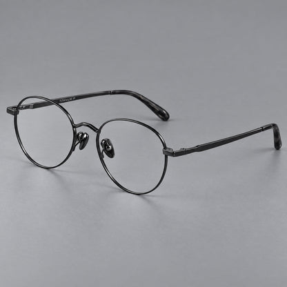 Retro panto titanium glasses with faceted corners and mottled curved temple tips in Black, three quarter view