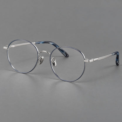 Retro panto titanium glasses with faceted corners and mottled curved temple tips in Gray Blue and Silver, three quarter view lens detail