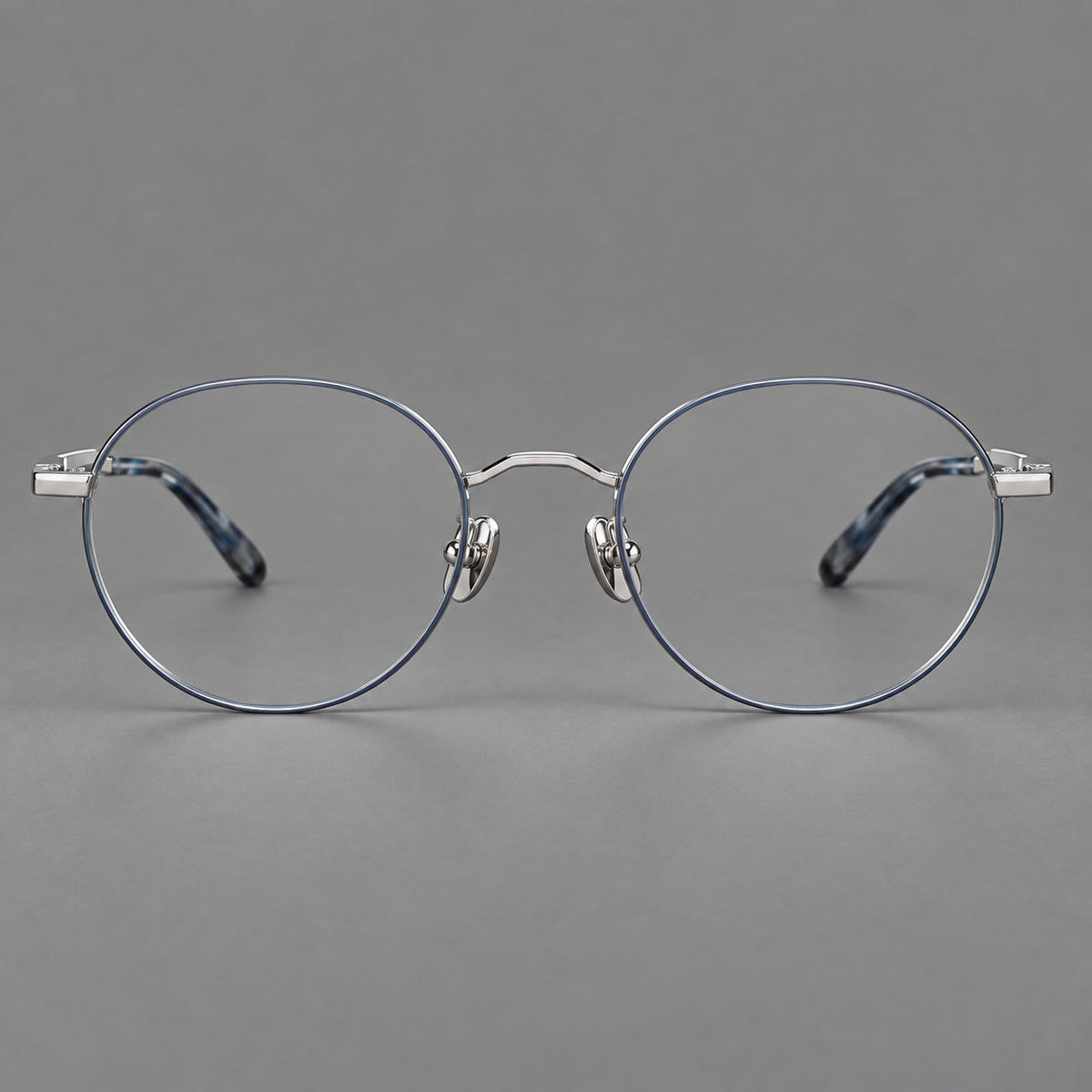 Retro panto titanium glasses with faceted corners and mottled curved temple tips in Gray Blue and Silver, front view