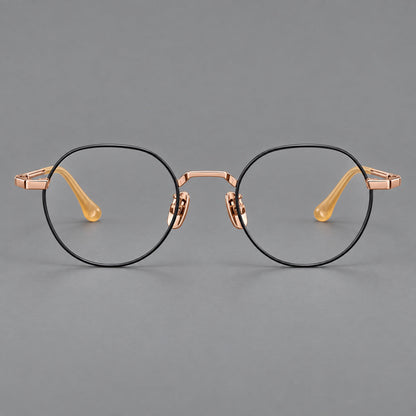 Small panto titanium glasses with an angular bridge and recessed temple details in Black and Rose Gold, front view frame detail