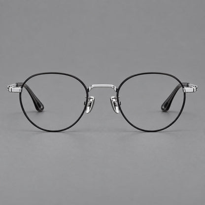 Small panto titanium glasses with an angular bridge and recessed temple details in Black and Silver, front view temple detail