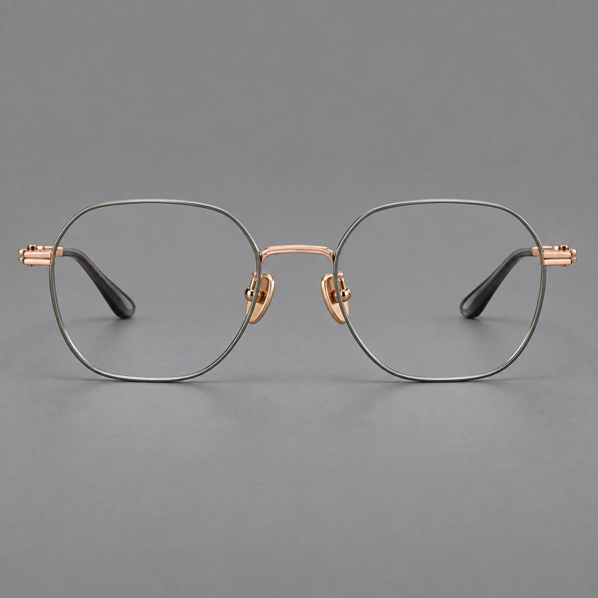 Soft square titanium glasses with an angular bridge and layered corner details in Green and Rose Gold, front view
