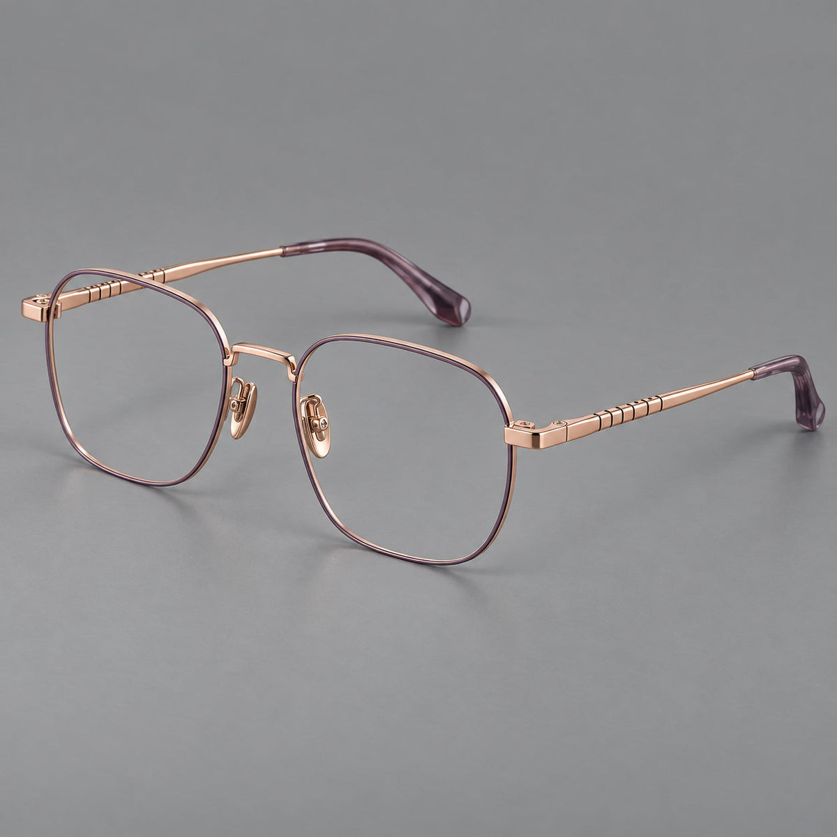 Soft square titanium glasses with a raised bridge and engraved temple bands in Purple and Rose Gold, three quarter view