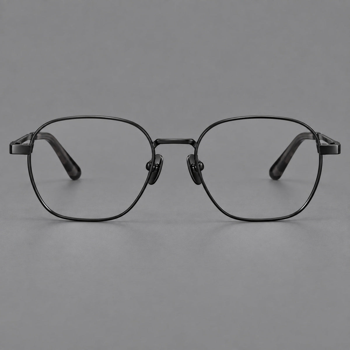 Rounded panto titanium glasses with an angular bridge and broad flat temples in Black, front view