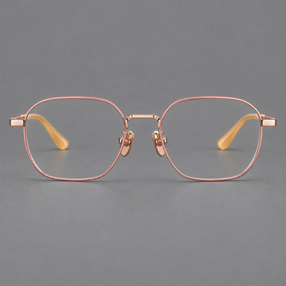 Rounded panto titanium glasses with an angular bridge and broad flat temples in Pink and Rose Gold, front view frame detail