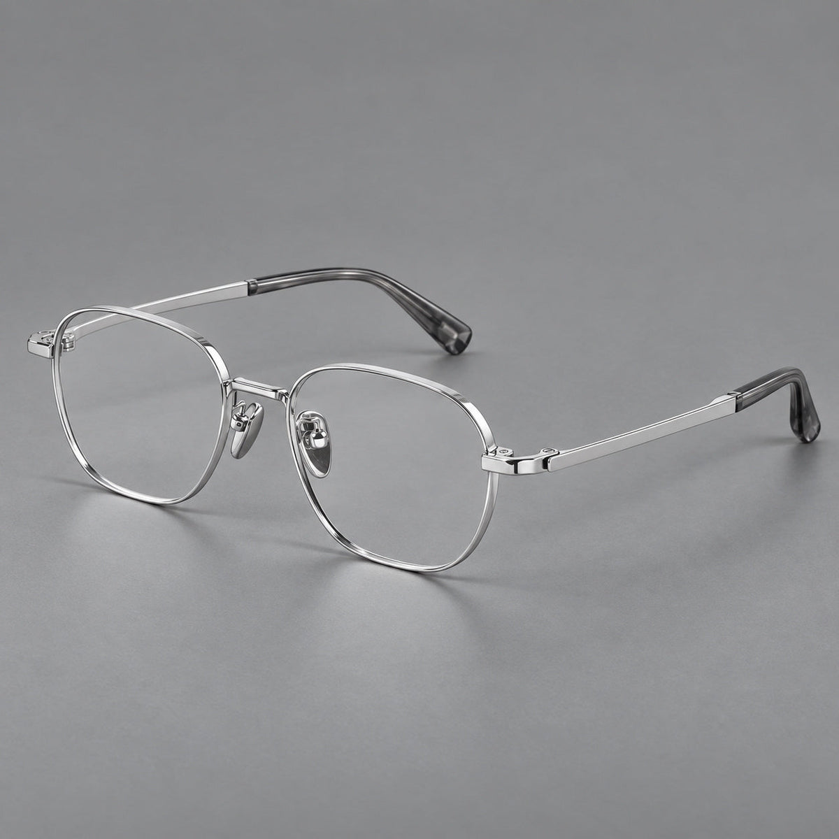 Rounded panto titanium glasses with an angular bridge and broad flat temples in Silver, three quarter view