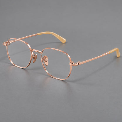 Rounded panto titanium glasses with an angular bridge and broad flat temples in Rose Gold, three quarter view additional product view