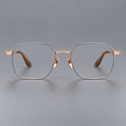 Geometric square titanium glasses with a textured bridge and fine temple grooves in Gray and Rose Gold, front view frame detail