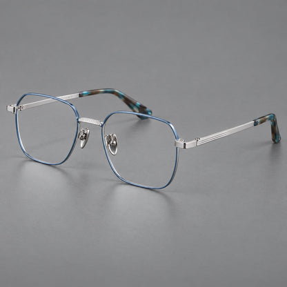 Geometric square titanium glasses with a textured bridge and fine temple grooves in Blue and Silver, three quarter view lens detail
